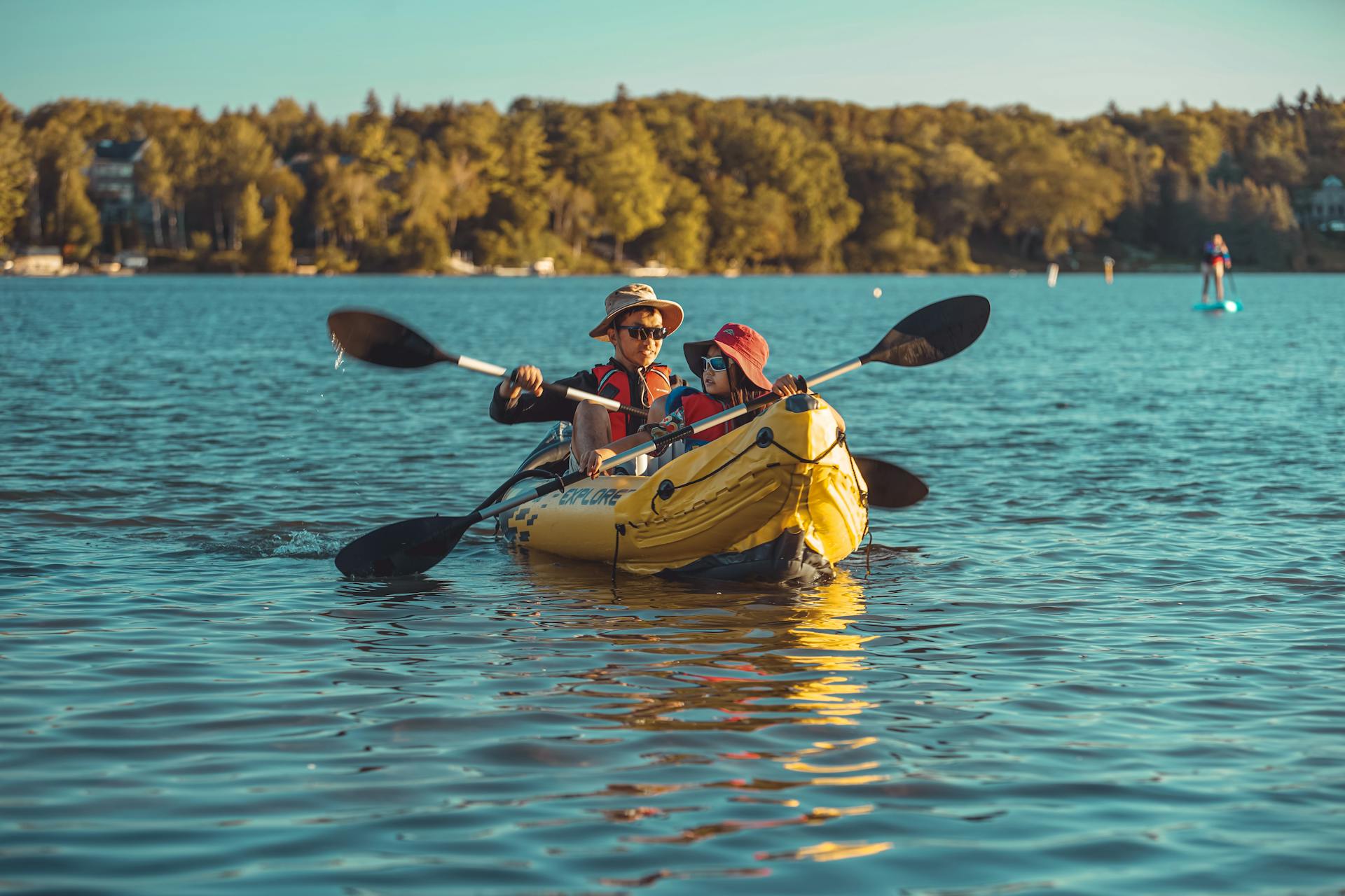 A Man and a woman kayaking on a lake