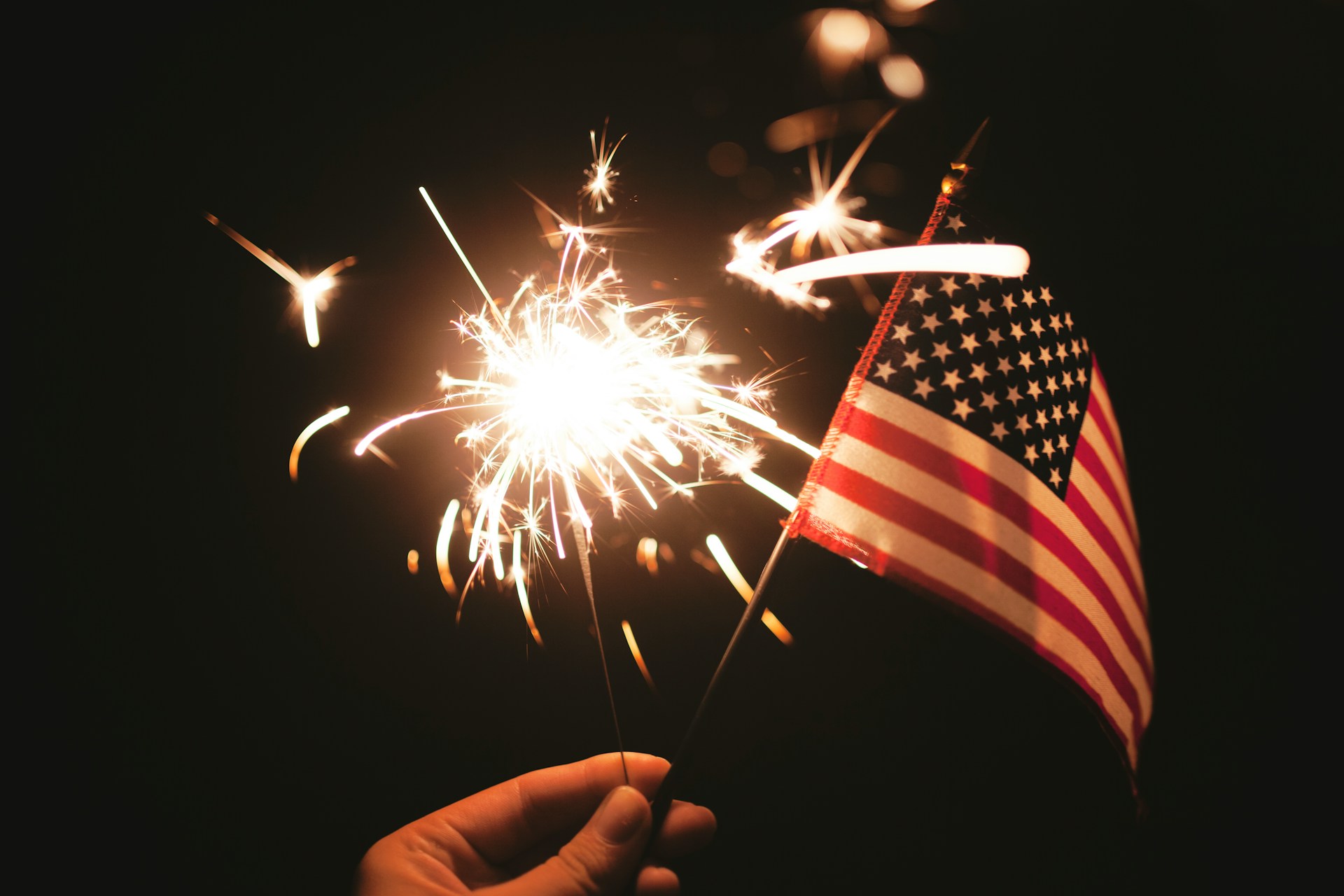 A sparkler with an American flag.